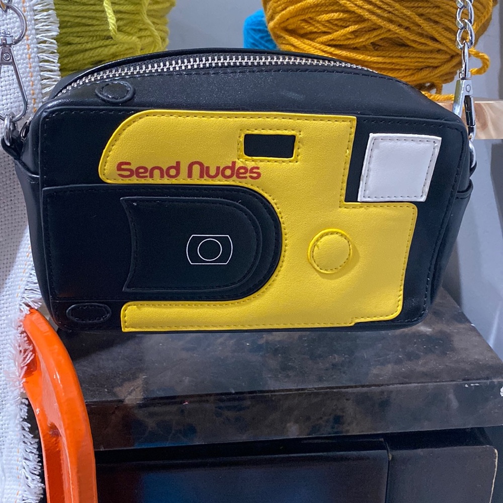 Crossbody send nudes camera bag.